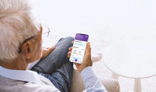 Patient using the Noona app on an iPhone